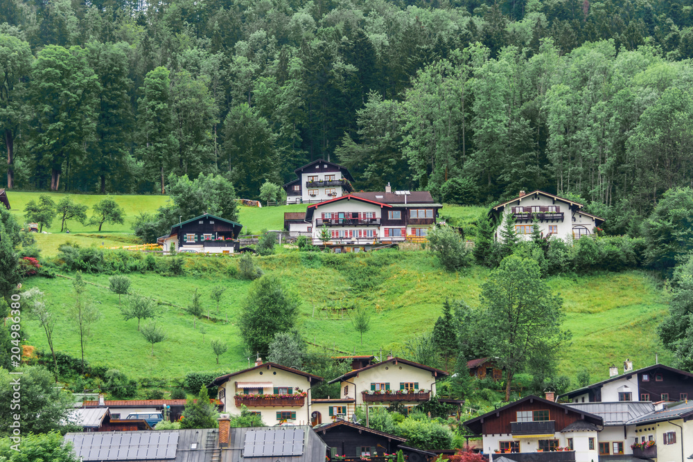 Summer view of houses, hotels and restaurants in the mountains, in the Alps, Berchtesgaden.