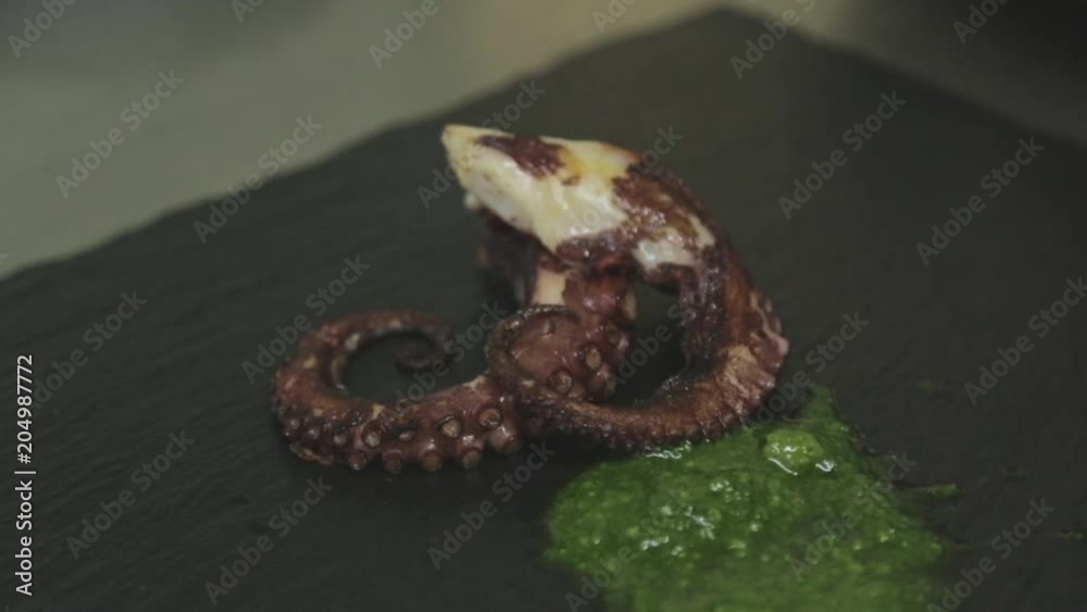 Close up, octopus placed on plate Close up, octopus placed on plate