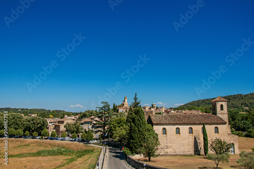 Panoramic view of the village of Lourmarin, its main street and hills in the background. In the Vaucluse department, Provence-Alpes-Côte d'Azur region, southeastern France