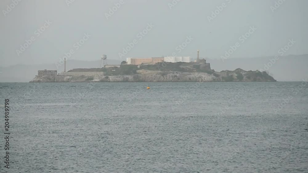 Alcatraz island and water in San Francisco, California, USA; America travel diversity Alcatraz island and water in San Francisco, California, USA; America travel diversity
