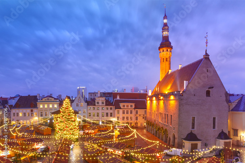 Decorated and illuminated Christmas tree and Christmas Market at Town Hall Square or Raekoja plats, Tallinn, Estonia. Aerial view