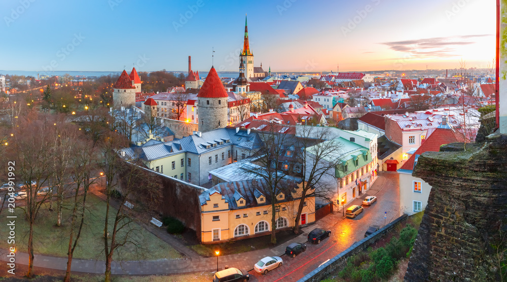 Fototapeta premium Aerial panoramic cityscape with Medieval Old Town, St. Olaf Baptist Church and Tallinn City Wall in the morning, Tallinn, Estonia