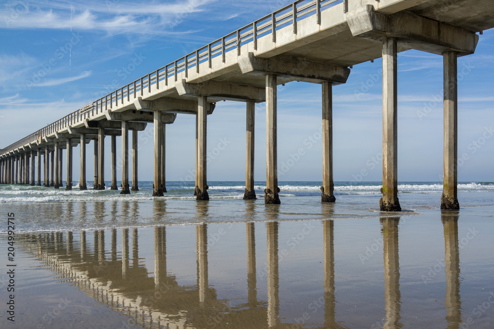 Reflection on the wet sand of Scripps Pier in La Jolla Shores