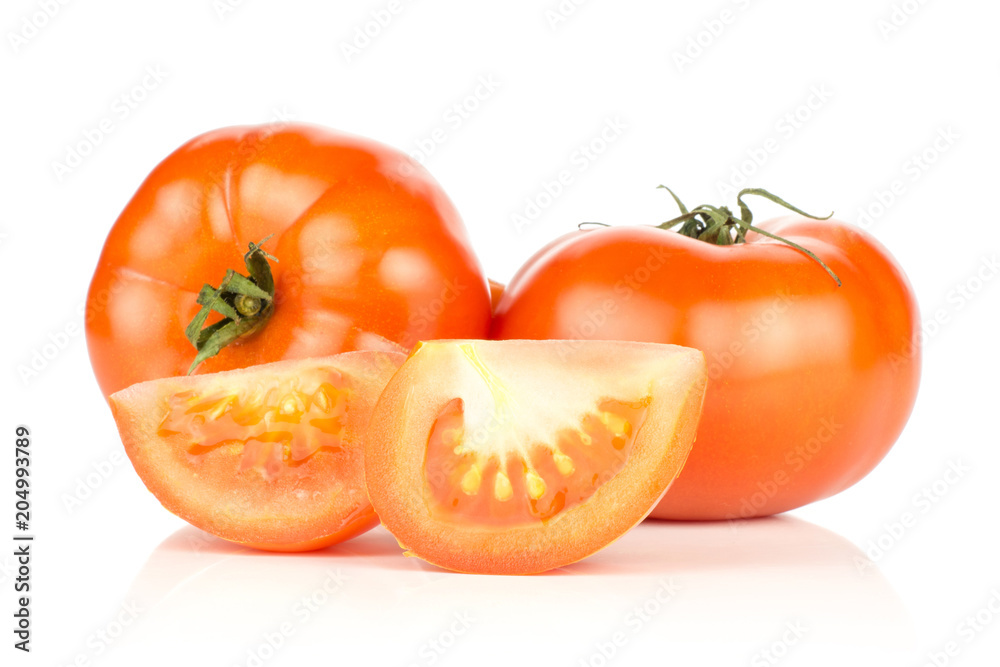 Two red tomatoes and two slices isolated on white background fresh. Two red tomatoes and two slices isolated on white background fresh.