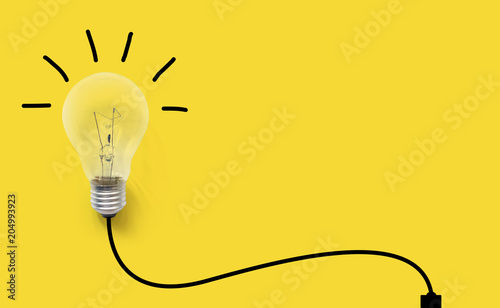 Creative thinking ideas brain innovation concept. Light bulb on yellow background photo