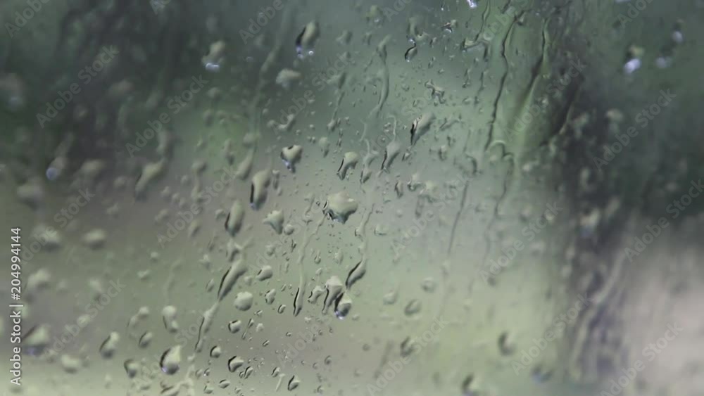 Close up, rain droplets on window Close up, rain droplets on window