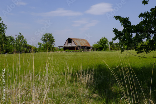 Abandoned barn in field in Loudoun County, Virginia photo