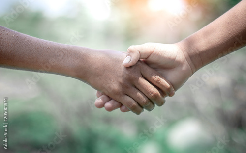Children shaking hands,the concept of friendship © surachat