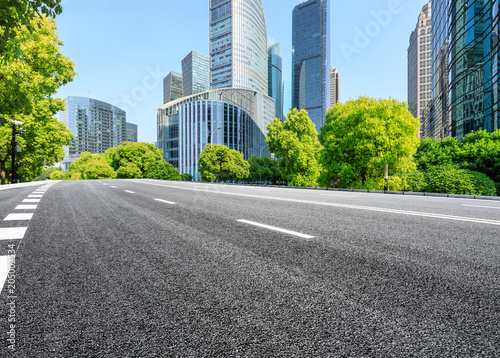 empty asphalt road and modern commercial office buildings in shanghai