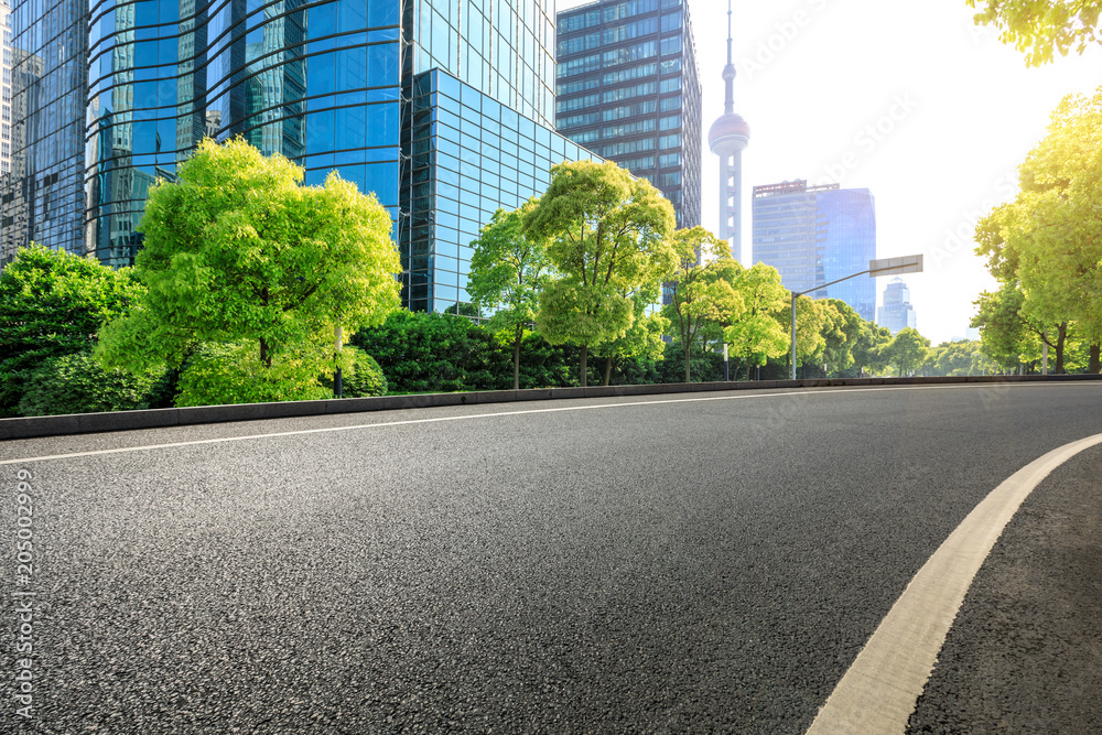 empty asphalt road and modern commercial office buildings in shanghai empty asphalt road and modern commercial office buildings in shanghai