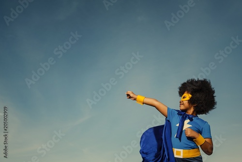 Strong superhero girl with superpowers photo