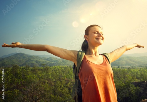 Woman enjoying th efresh air in nature photo