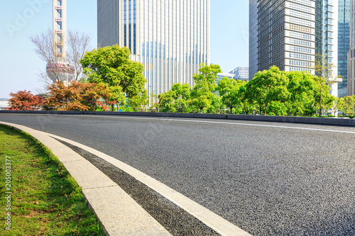 empty asphalt road with city skyline background in shanghai China