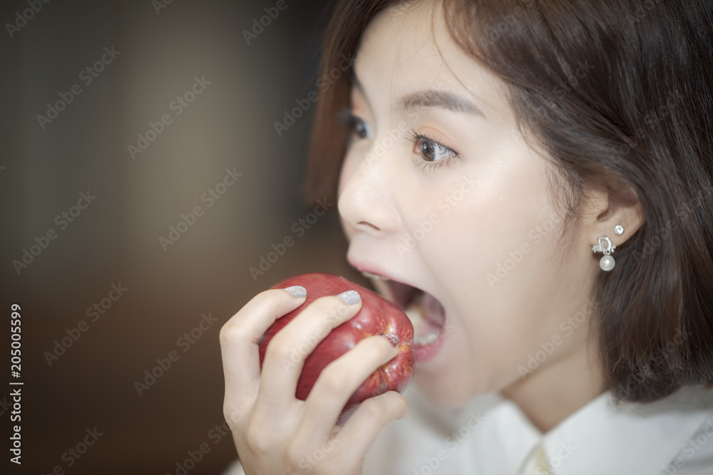 beautiful woman open wide mouth to bite the red apple beautiful woman open wide mouth to bite the red apple