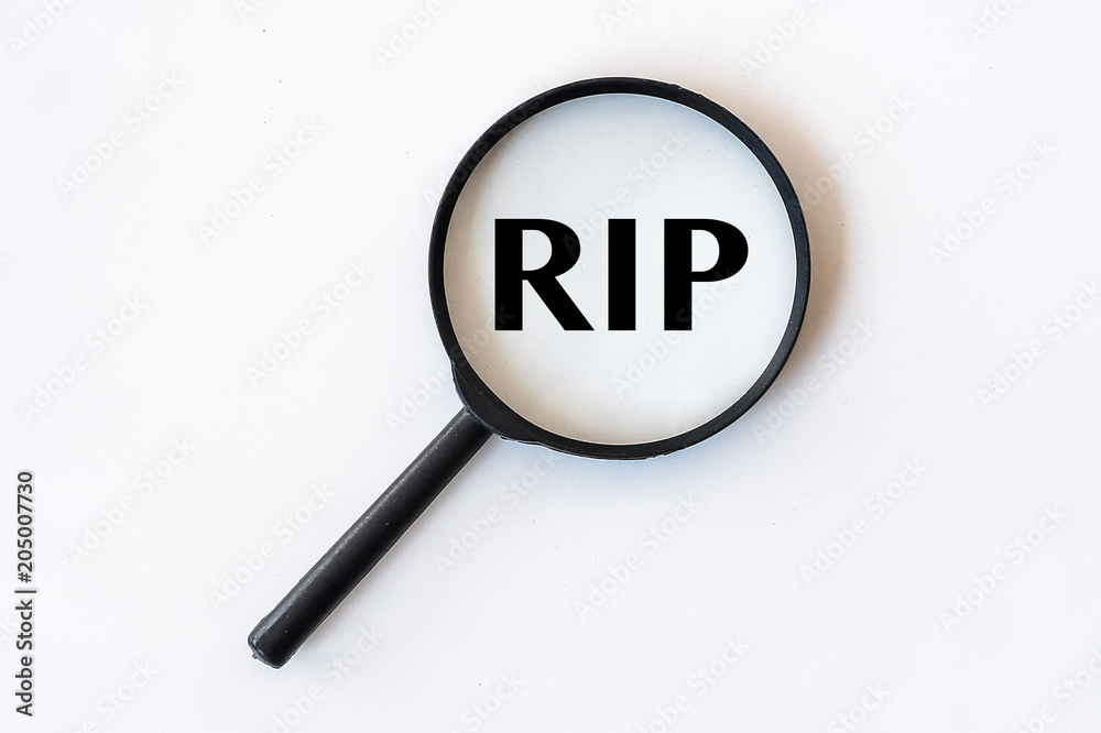RIP word in Magnifying Glass isolated with whte background RIP word in Magnifying Glass isolated with whte background