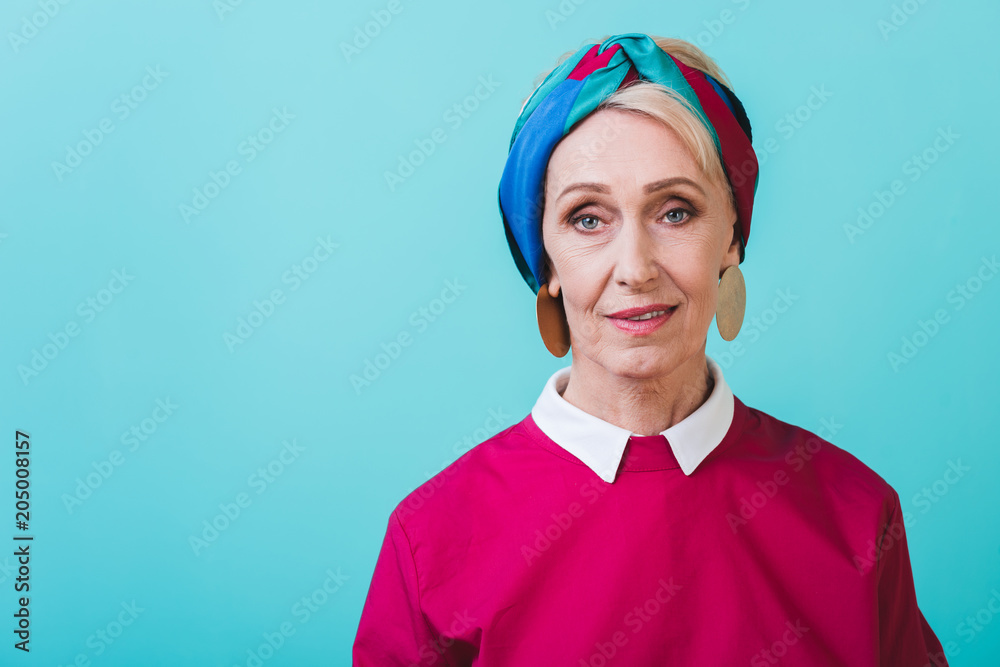 portrait of stylish beautiful senior woman, isolated on blue portrait of stylish beautiful senior woman, isolated on blue