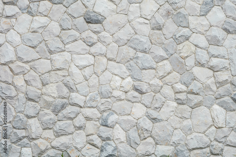 Obraz premium Closeup surface abstract at old stone wall in the garden textured background