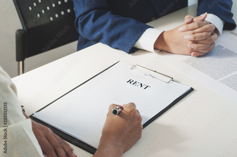 Real Estate agent and customer discussing price valuation