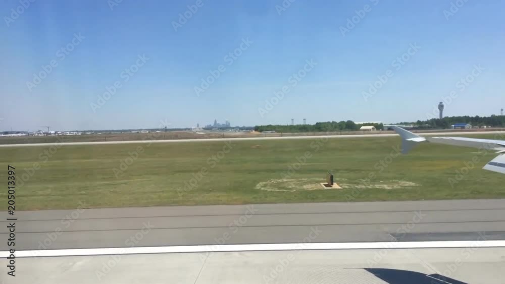 Airplane landing on runway at airport