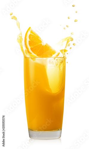 Glass of orange juice with splash and orange slice