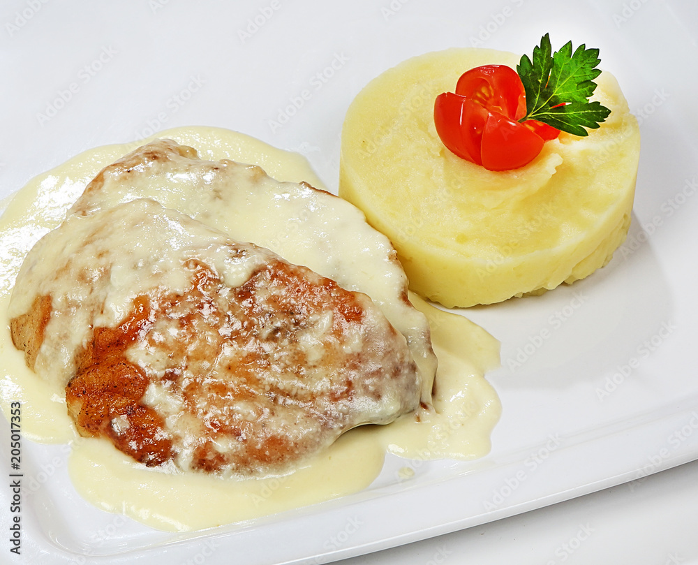 Turkey.in cream sauce, served with mashed potatoes Turkey.in cream sauce, served with mashed potatoes