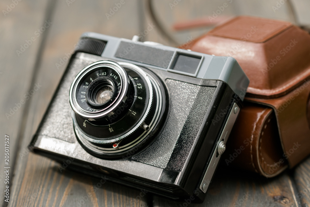 Old-fashioned vintage film camera. Creativity and imagination