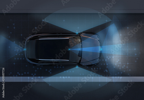Top view of self-driving SUV on the road with sensing graphic pattern retouched. night traffic.  3D rendering image. photo