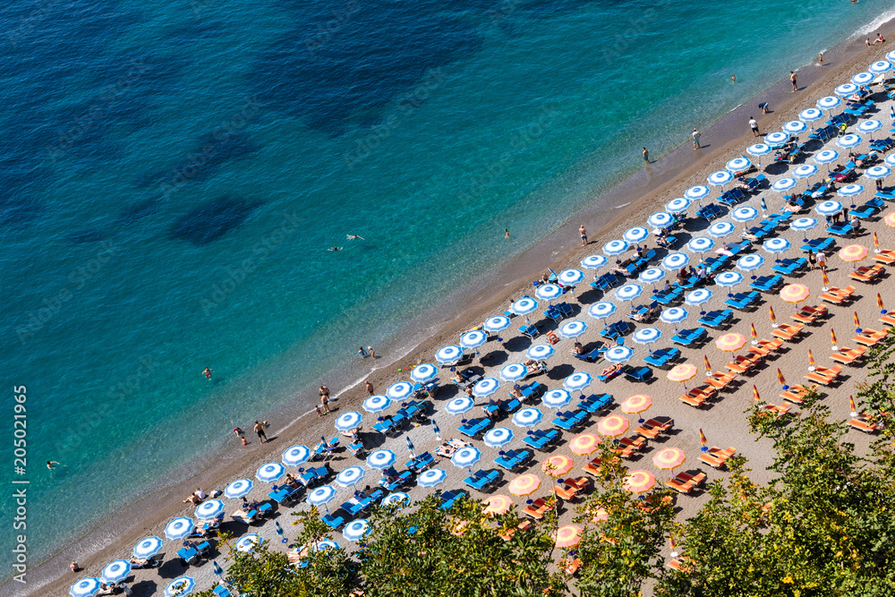 Positano Amalfi Coast Neaples Italy - Abstract view of beach with umbrella rows. Positano Amalfi Coast Neaples Italy - Abstract view of beach with umbrella rows.