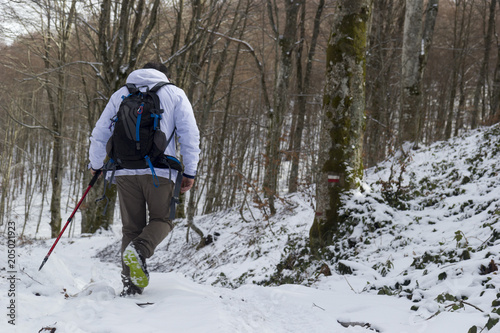 hiker on mountain trail with snow in matese park guardiaregia
