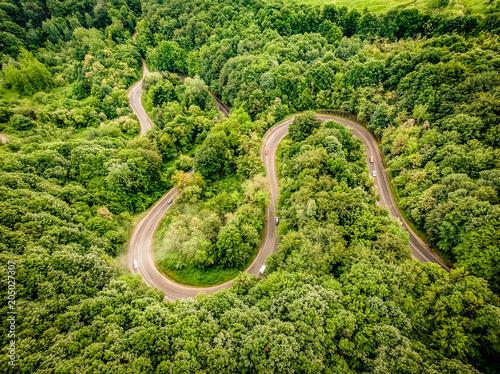 Aerial view of an extreme winding road up in the mountains