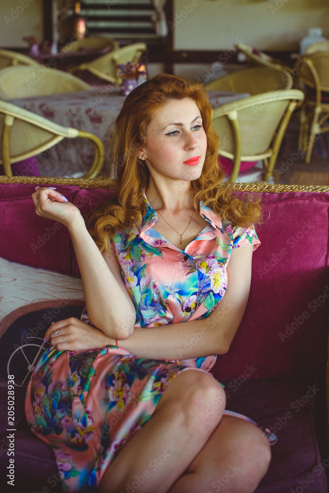 Woman in vintage dress 1950s style interior retro style in modern life pretty girl look nice and rest on weekend in kitchen foto de Stock Adobe Stock