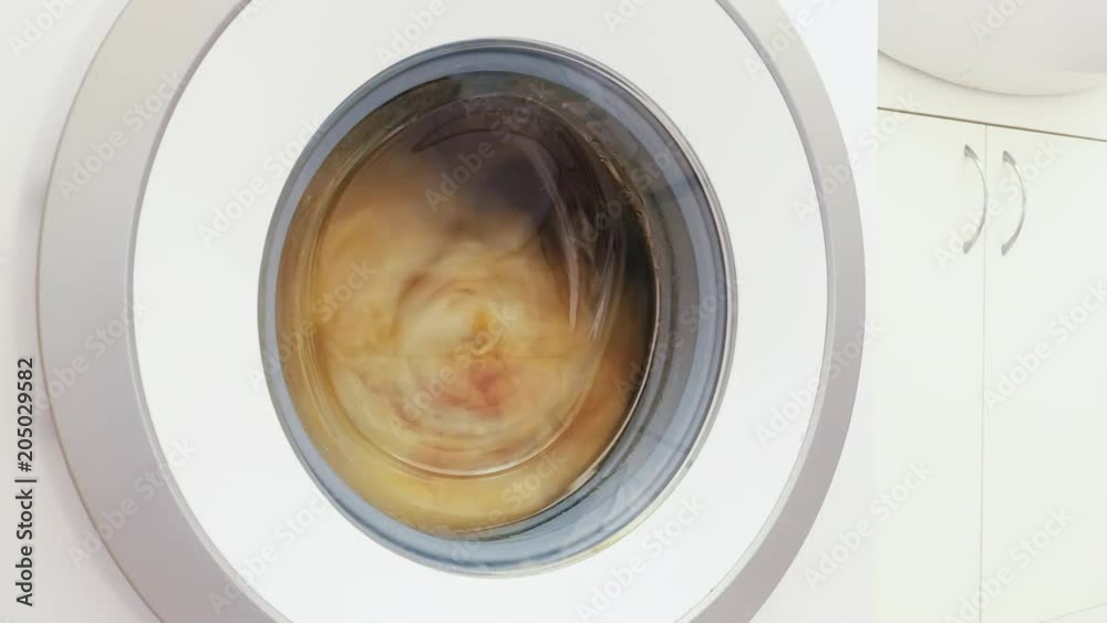Timelapse, process of washing clothes in washing machine.
