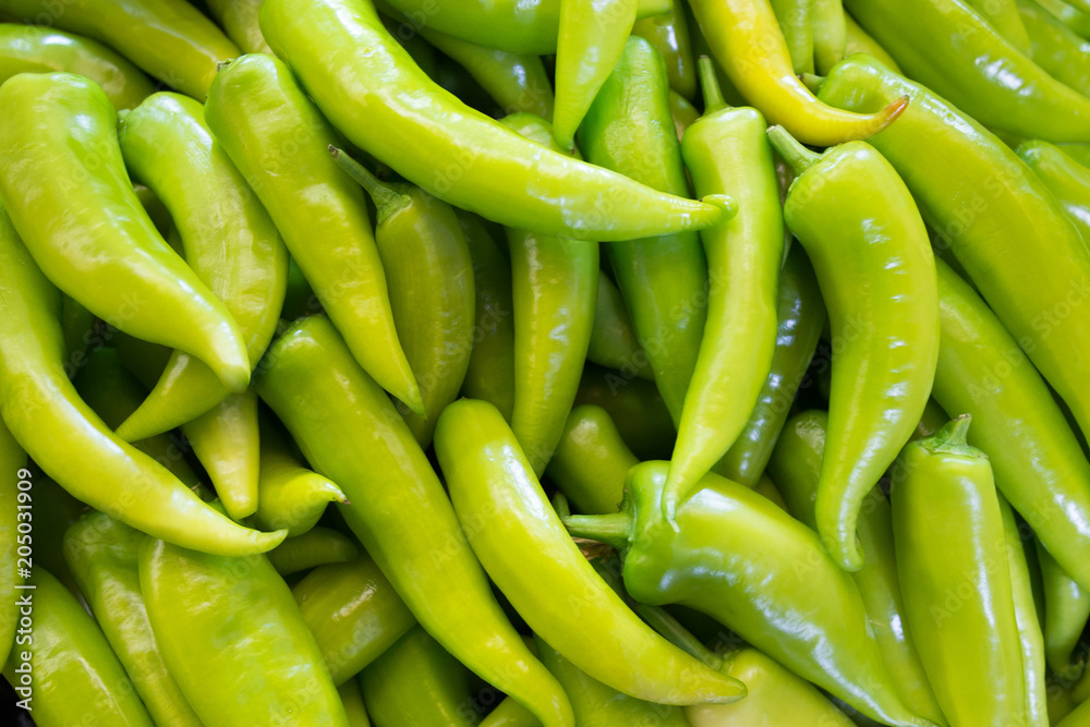 Light green pepper background, Peppers in a group on market background Light green pepper background, Peppers in a group on market background