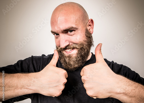 a smiling bearded man
