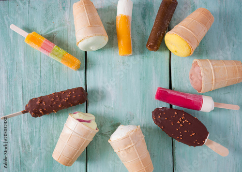 Ice cream in waffle cup and popsicles photo