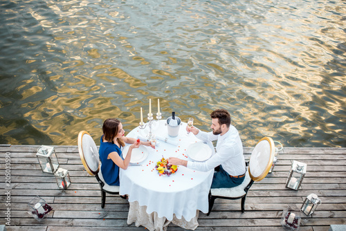 Couple having a romatic dinner on the riverside © rh2010
