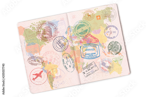 Passport and lot of stamps on it. Isolated on white background