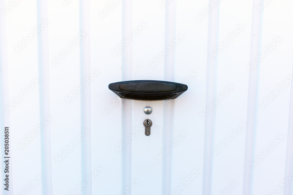 Garage door with small lock. Garage door with small lock.
