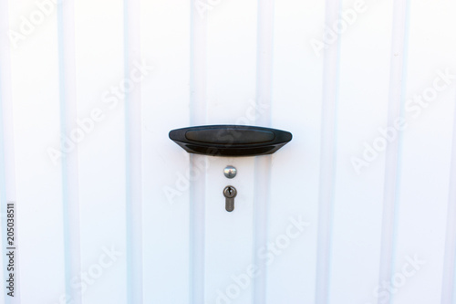 Garage door with small lock.