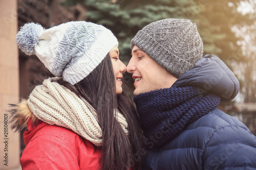 Cute couple in warm clothes outdoors