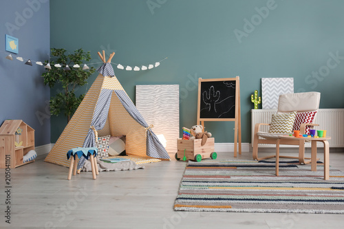 Modern room interior with play tent for child photo