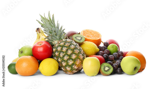 Rainbow collection of ripe fruits on white background
