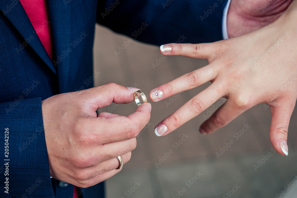 Groom wear a bride ring. Wedding offer, engagement, family education - concept
