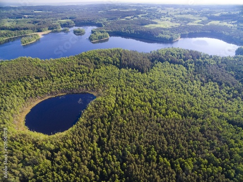 Aerial view of beautiful landscape of Mazury region, Kacze Lake in the foreground, Krzywa Kuta Lake in the background, Poland photo