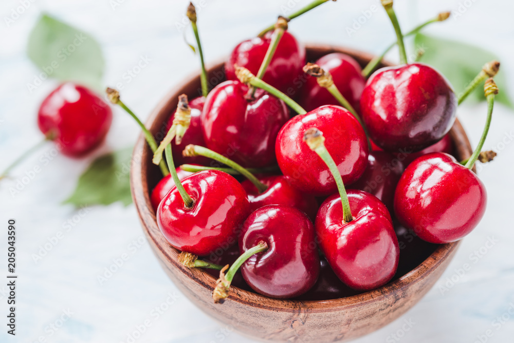 Cherry fruits on white wood table. Cherry fruits on white wood table.
