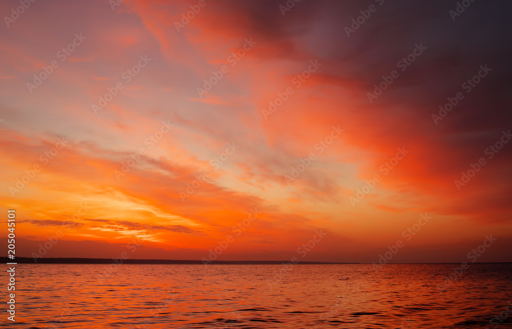 Magic orange sunset over sea. Sunrise over Beach