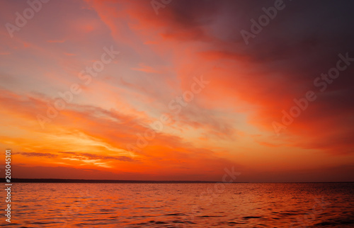 Magic orange sunset over sea. Sunrise over Beach © es0lex
