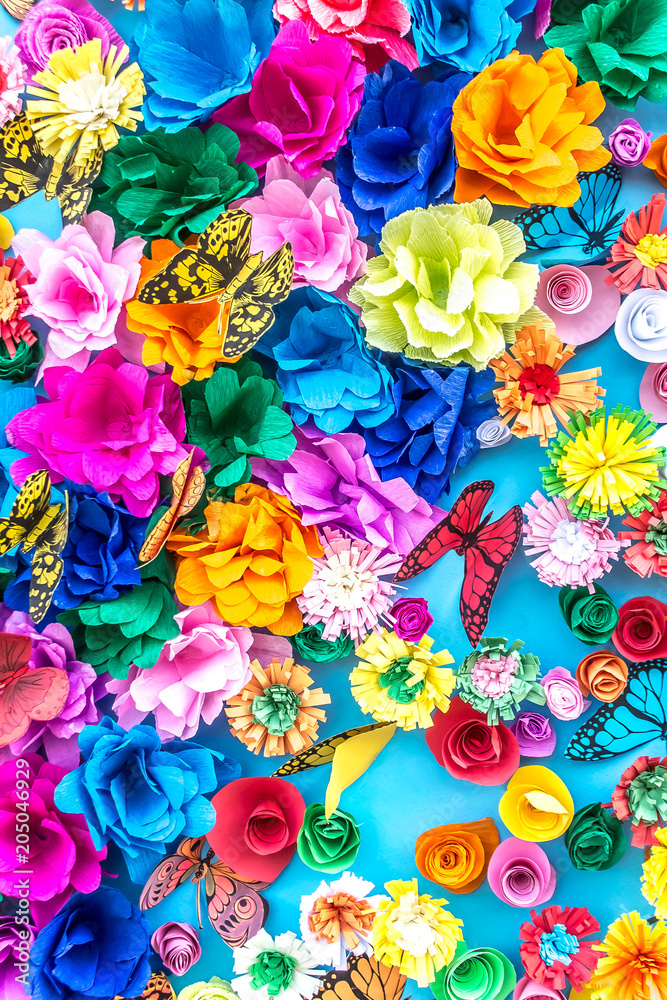 Bright paper artificial flowers as a background