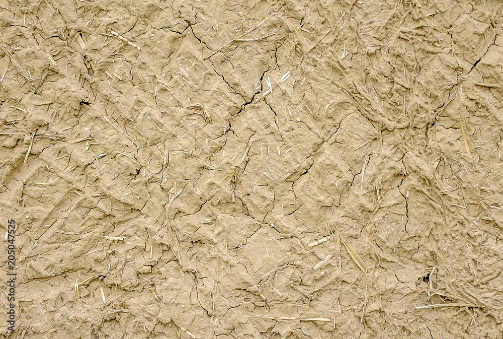 Wall of clay with straw as background Wall of clay with straw as background