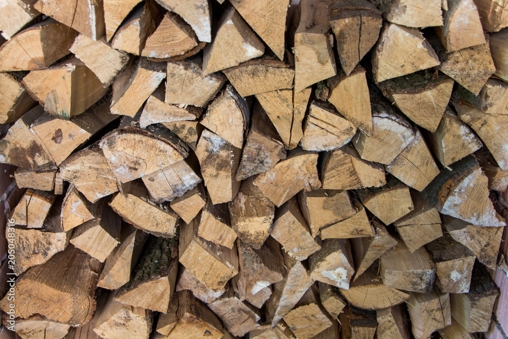 Texture of the firewood. Stacked woodpile. Texture of the firewood. Stacked woodpile.